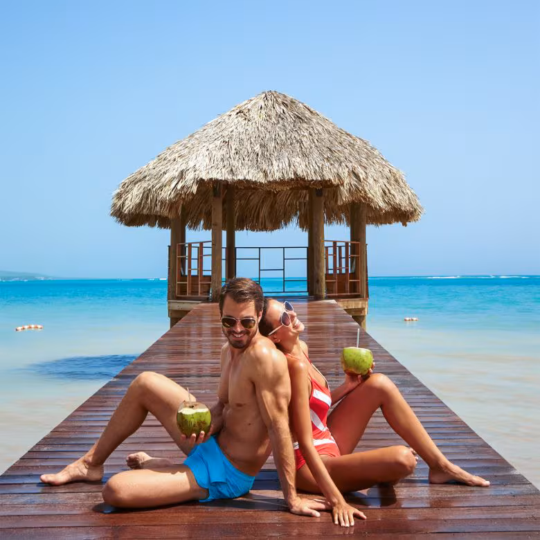 Family enjoying tropical beach activities together