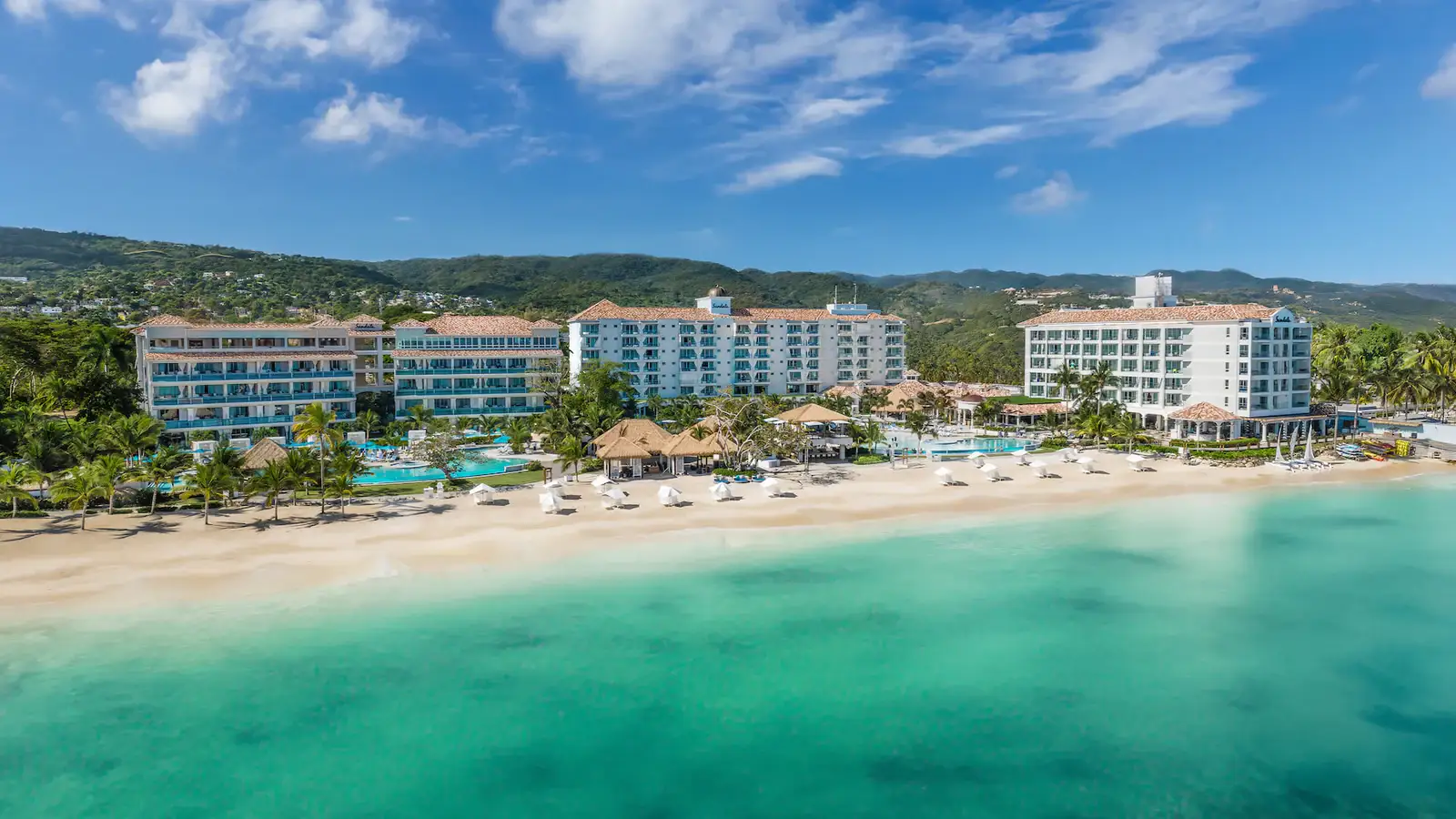 Aerial view of Sandals Dunn's River resort in Ocho Rios with modern architecture and river-style pools