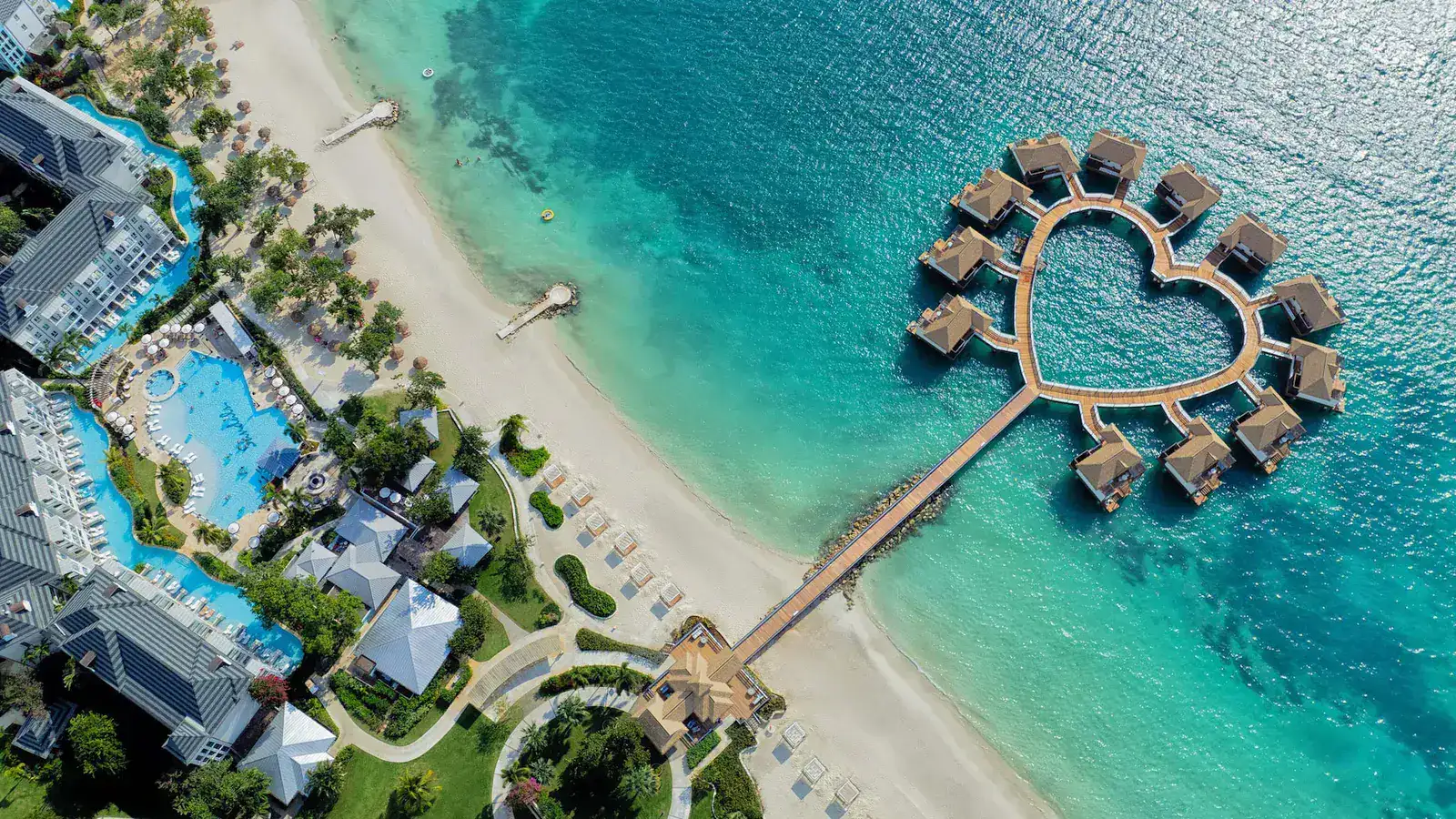 Aerial view of overwater bungalows at a luxury Caribbean resort