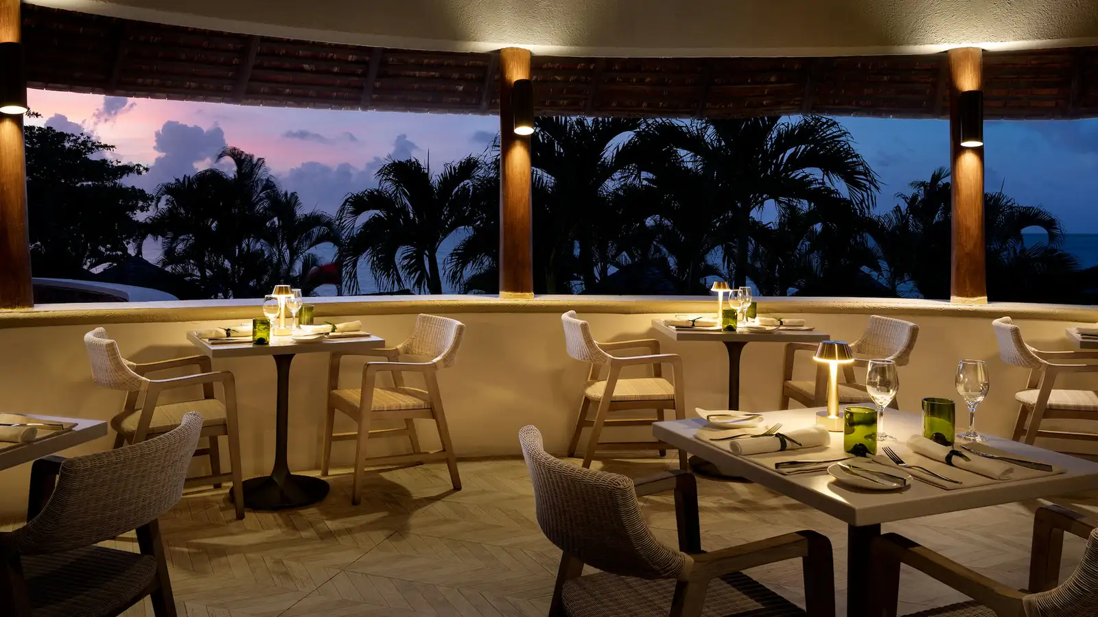 Romantic oceanfront dinner at sunset at Sandals Regency La Toc with gourmet cuisine