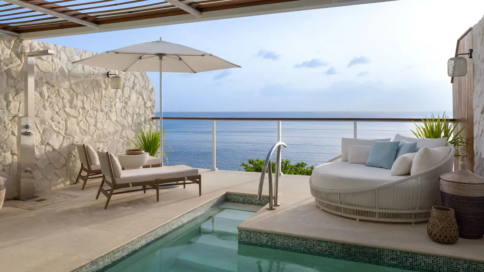 Stunning panoramic ocean view from a luxury balcony at Sandals Regency La Toc with the Pitons in the distance